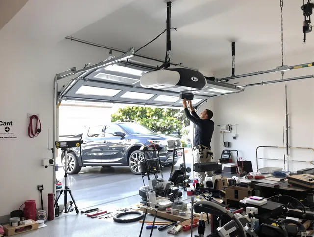Mansfield Garage Door Repair specialist installing smart garage door opener system in Mansfield home