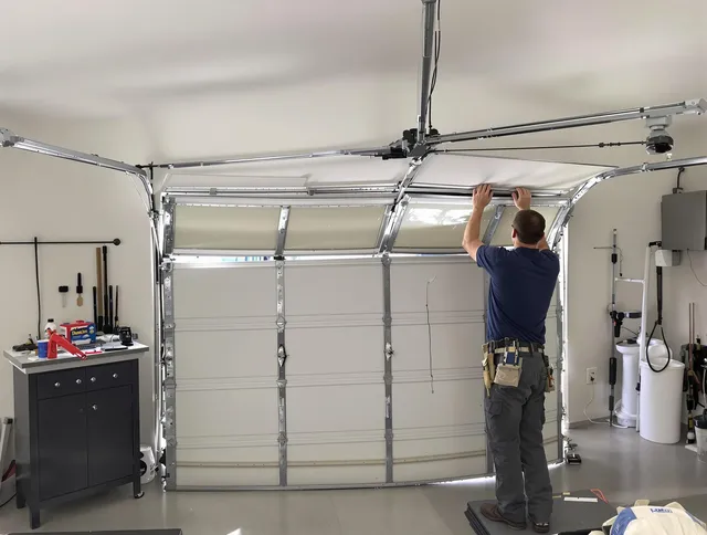 Mansfield Garage Door Repair specialist performing precise section replacement on Mansfield garage door