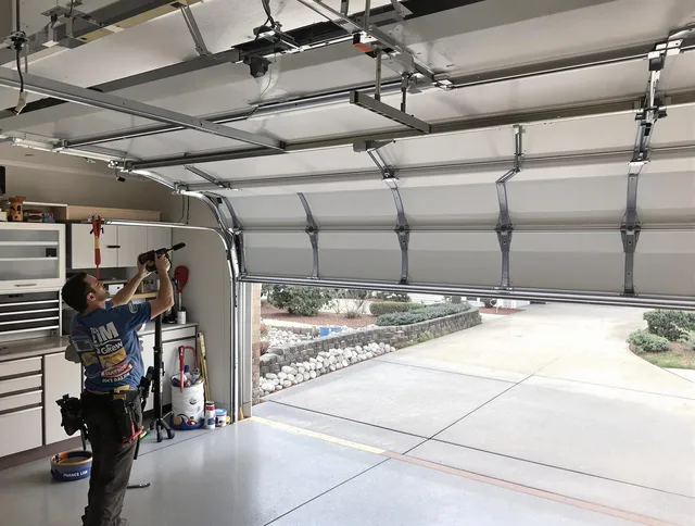 Garage door track repair service by Mansfield Garage Door Repair in Mansfield
